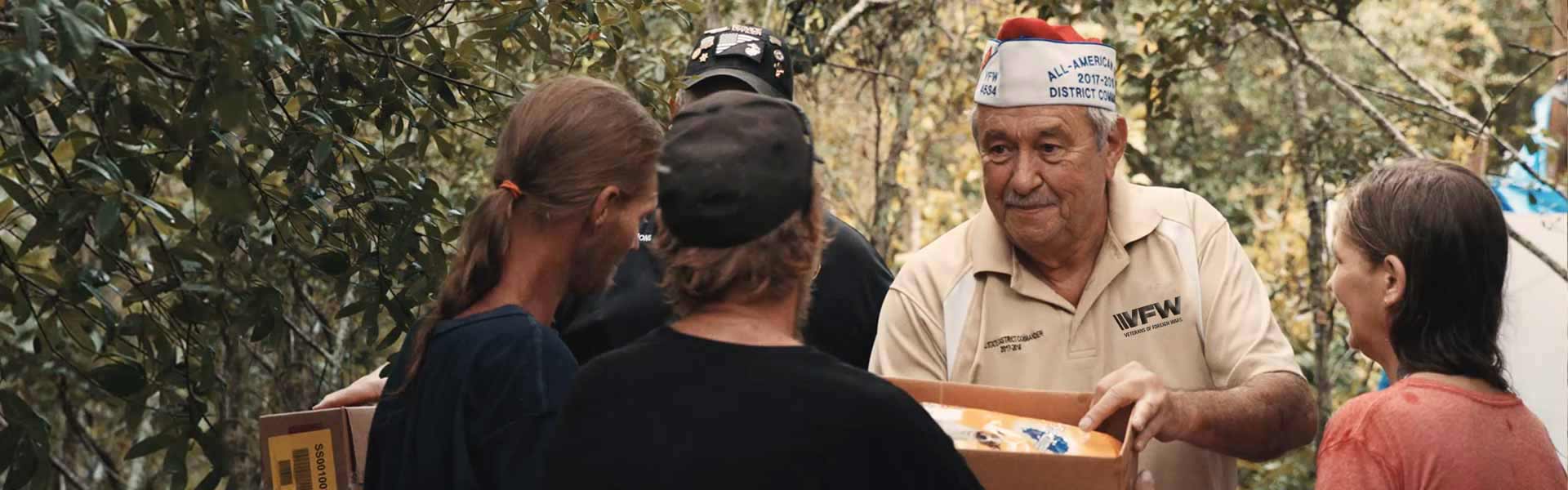 VFW member man passing out supplies