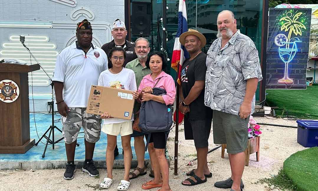 VFW Post 12146 presents the daughter of a member who passed several years ago with a laptop and backpack for her upcoming collegiate career during a Memorial Day 