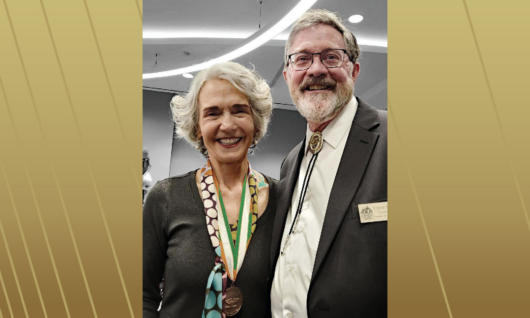 Dr. Elizabeth Cobbs, left, and Ed Saunders, VFW member, who helped the Hello Girls receive the Congressional Medal of Honor