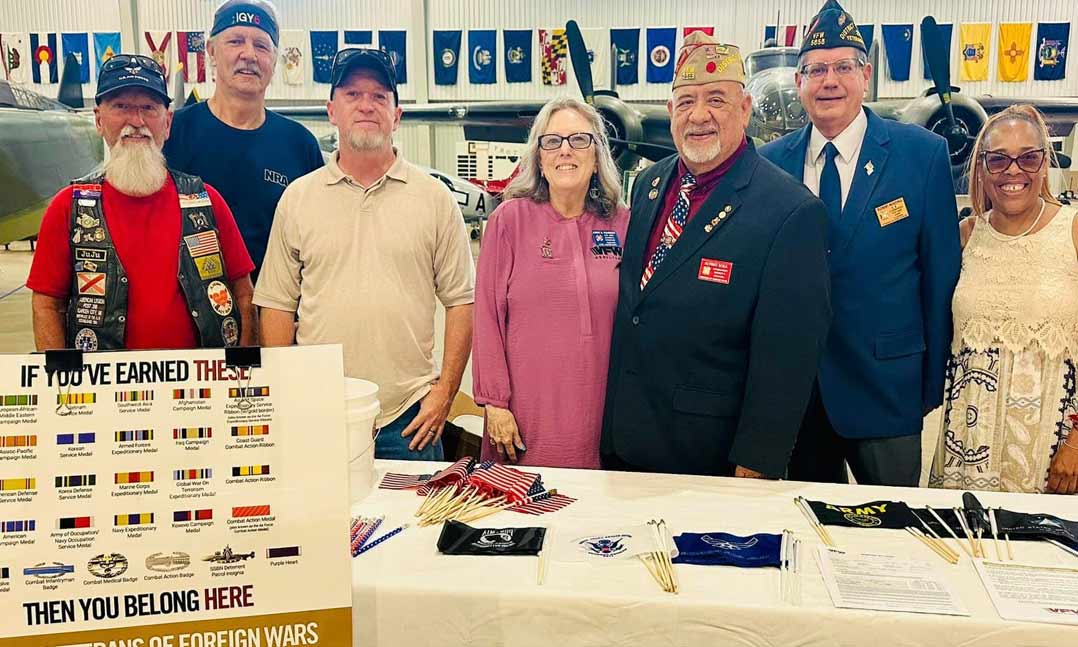 VFW Post 5856 members in Elberta, Alabama, present veterans in hospice care with military service coins