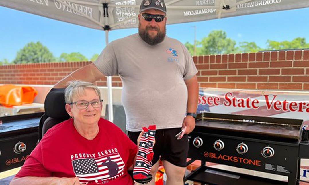 VFW Post 4575 Quartermaster Jerry Stewart, center, visits with a resident of the Tennessee State Veterans Home