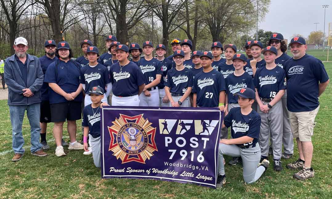 VFW Post 7916 Commander Jeff Lett, far left, joins Woodbridge Little League players and coaches