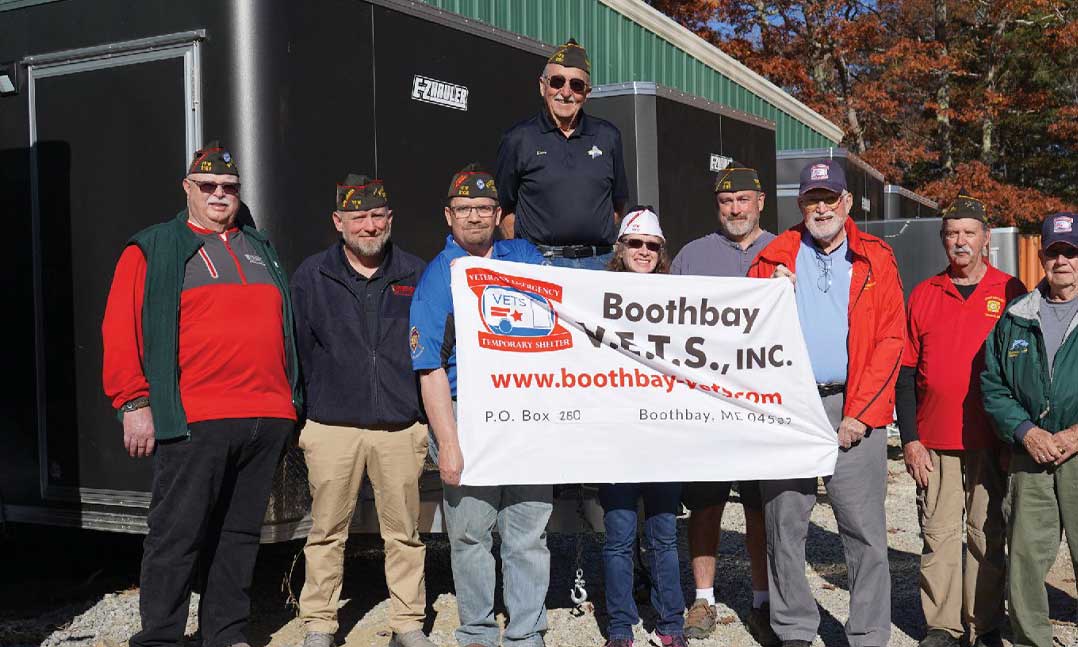 Volunteers with Boothbay V.E.T.S. gather outside their headquarters in October near Boothbay, Maine