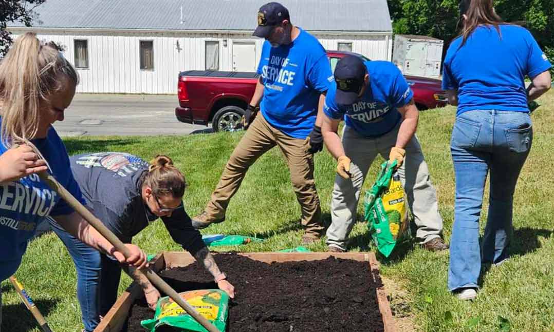 Members of VFW Post 56 rebuild a garden